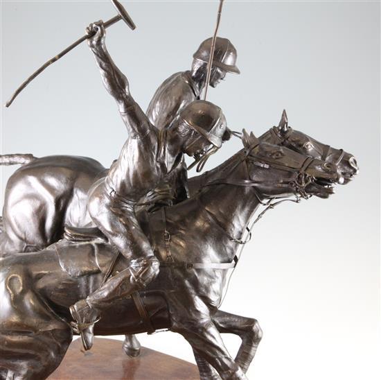 A 20th century bronze equestrian figure group, modelled as two polo players, 23.5in.